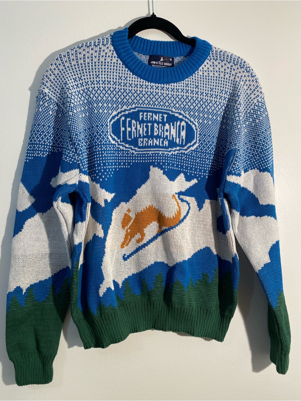 This is Feliz Navidad Fernet Branca sweater size M